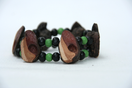 Double-stranded beaded bracelet with green and black beads using elastic