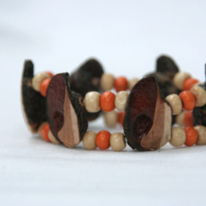 beaded, elastic bracelet with orange and cream wood beads