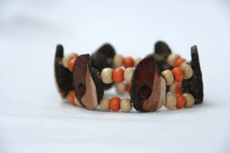 beaded, elastic bracelet with orange and cream wood beads