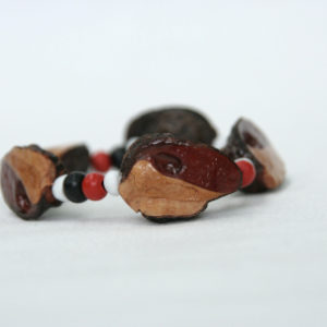 Beaded elastic bracelet with red, white and black wood painted beads